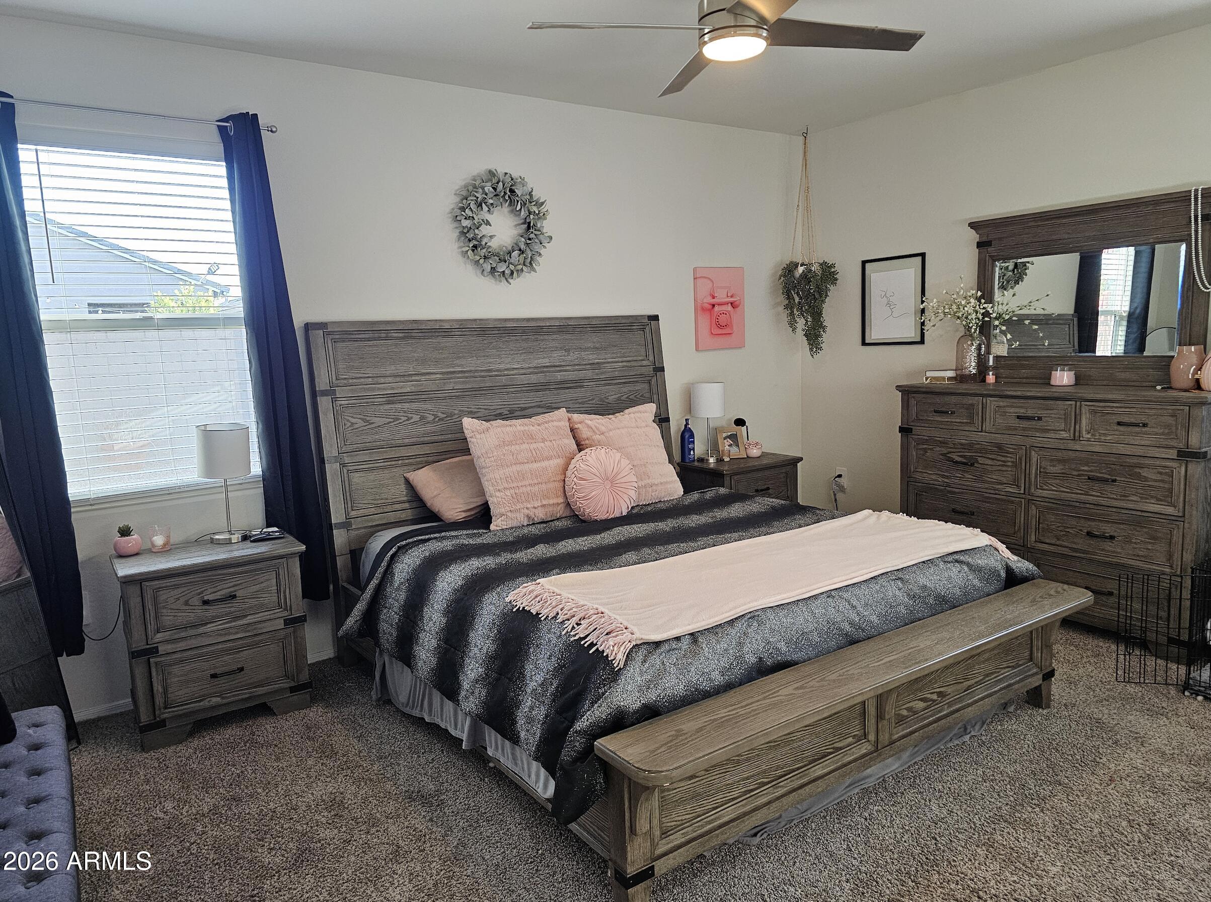 9434 Cotton Road Florence, AZ 85132 - Photo 10 of 25 a bedroom with a bed and a chandelier