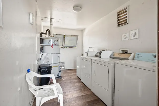 a kitchen with cabinets and window