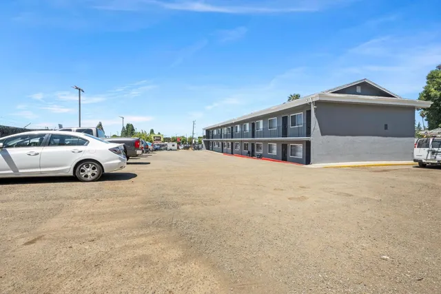 a view of a car park in front of house