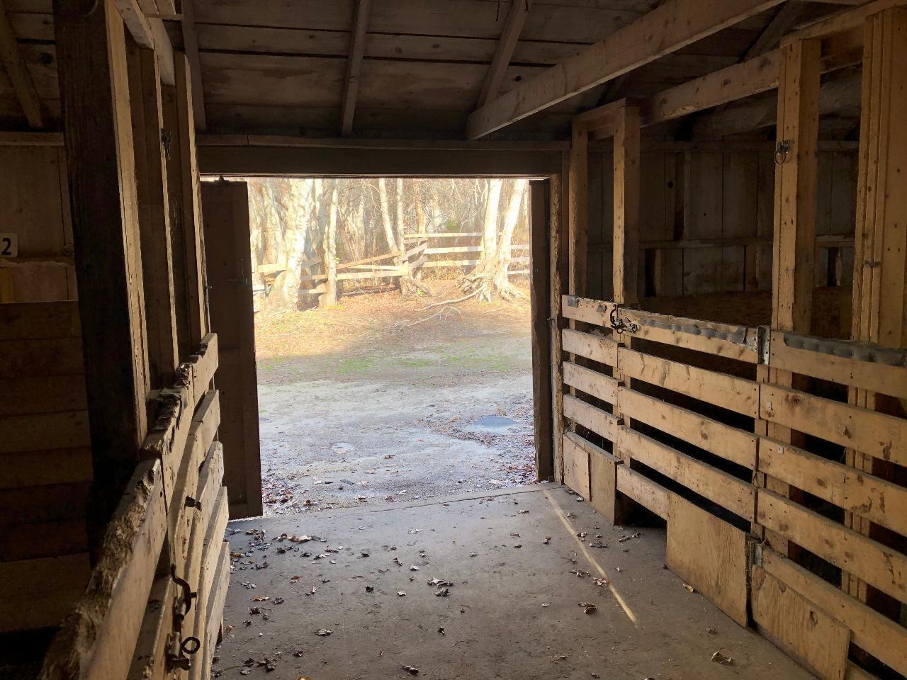 347 Santuit-Newtown Road Marstons Mills, MA 02648 - Photo 22 of 26 a view of a porch with wooden floor and a floor to ceiling window