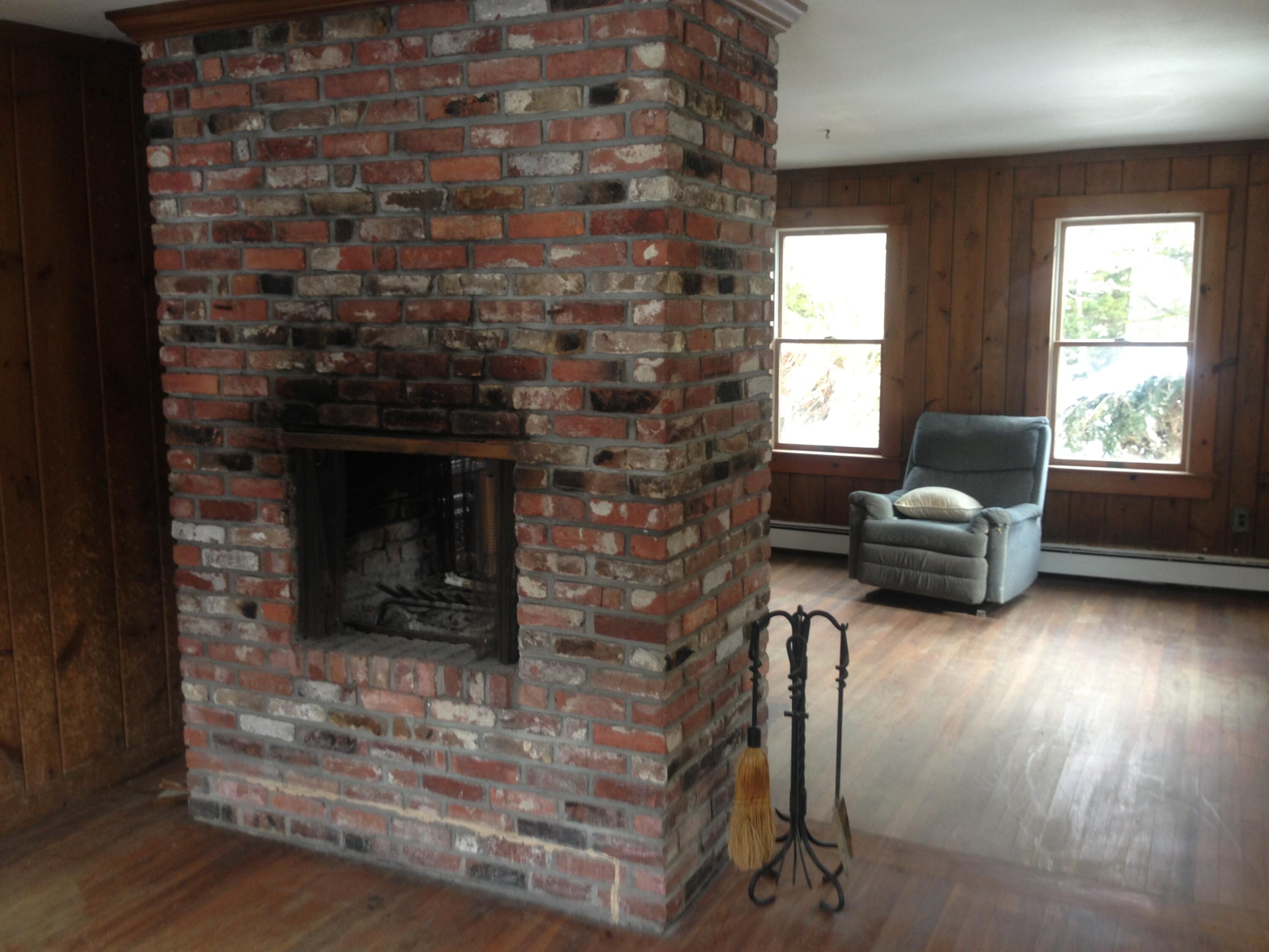 347 Santuit-Newtown Road Marstons Mills, MA 02648 - Photo 4 of 26 a living room with furniture and a fireplace