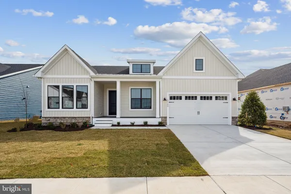 a view of front of house with a yard