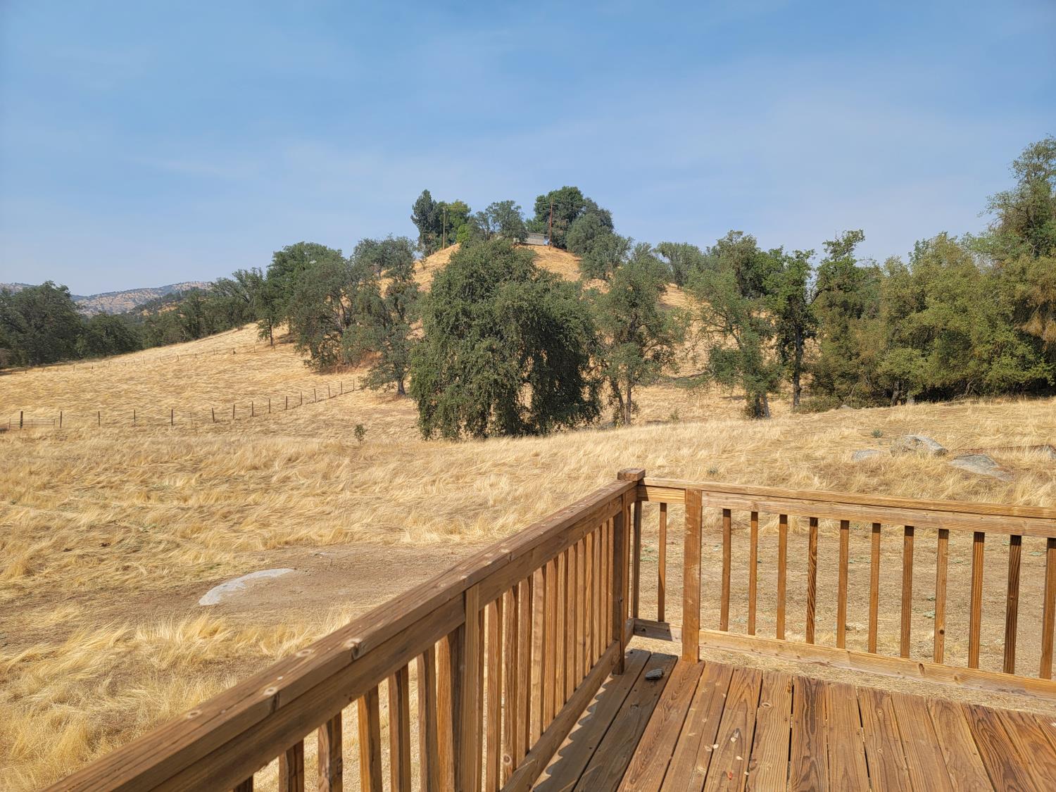 37041 Dunlap Road Squaw Valley, CA 93675 - Photo 14 of 24 a view of a balcony with wooden fence