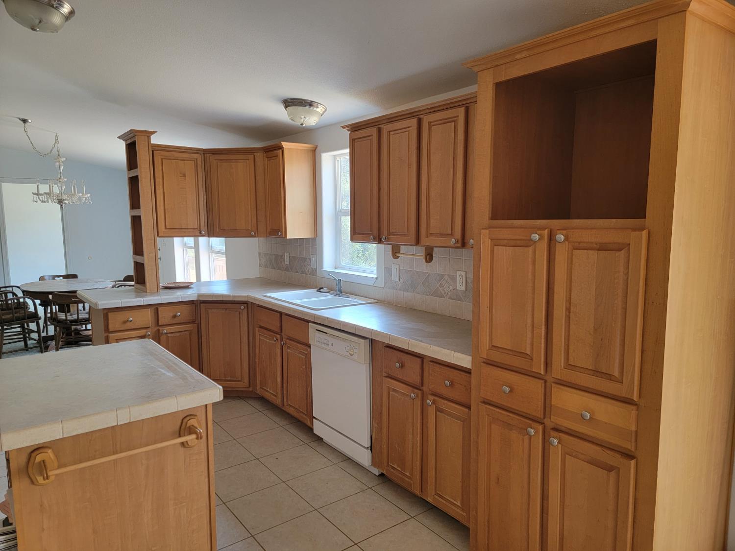 37041 Dunlap Road Squaw Valley, CA 93675 - Photo 3 of 24 a kitchen with stainless steel appliances granite countertop wooden cabinets a sink and a window
