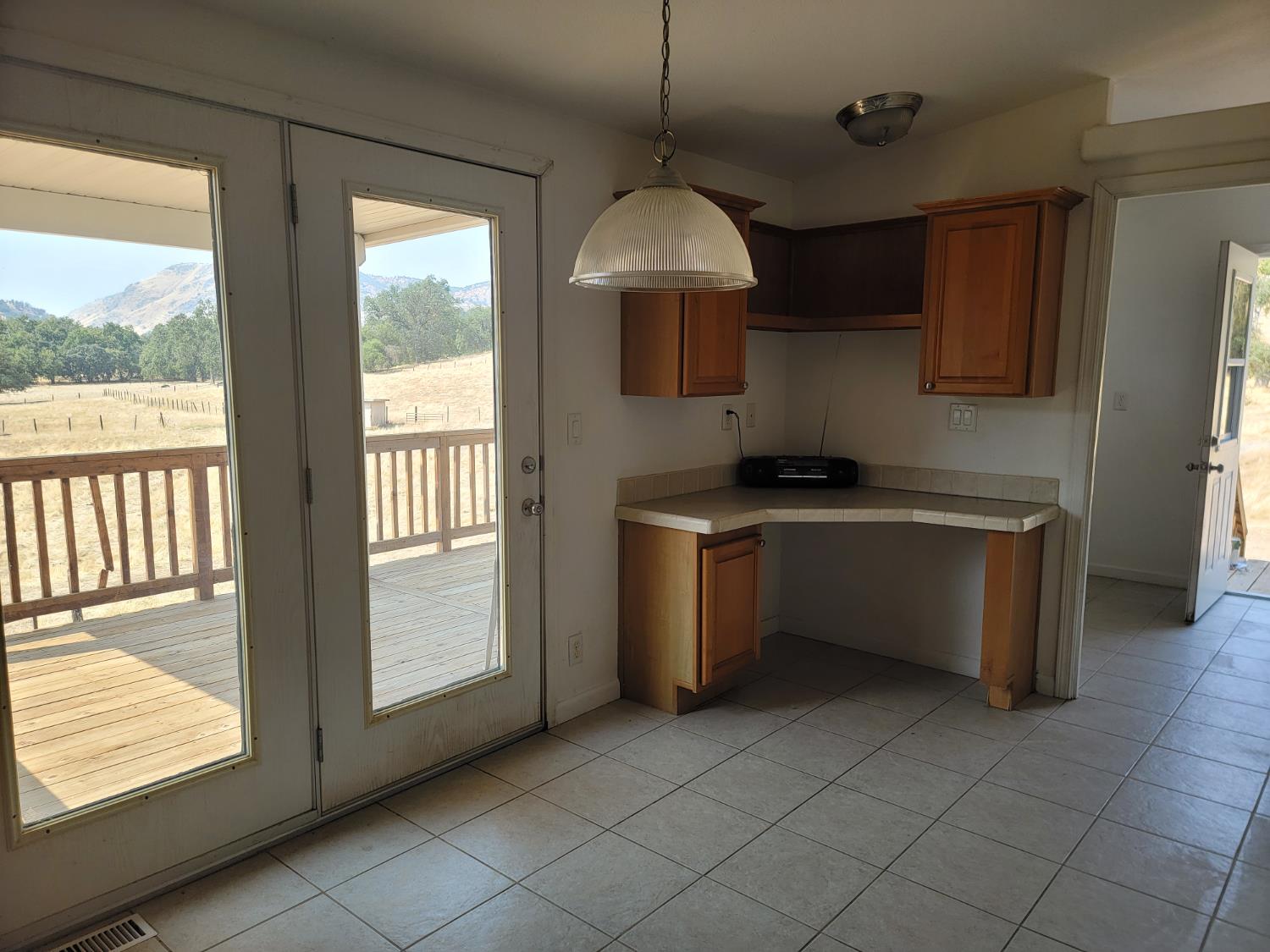 37041 Dunlap Road Squaw Valley, CA 93675 - Photo 5 of 24 a kitchen that has a sink a microwave oven a counter top space and cabinets