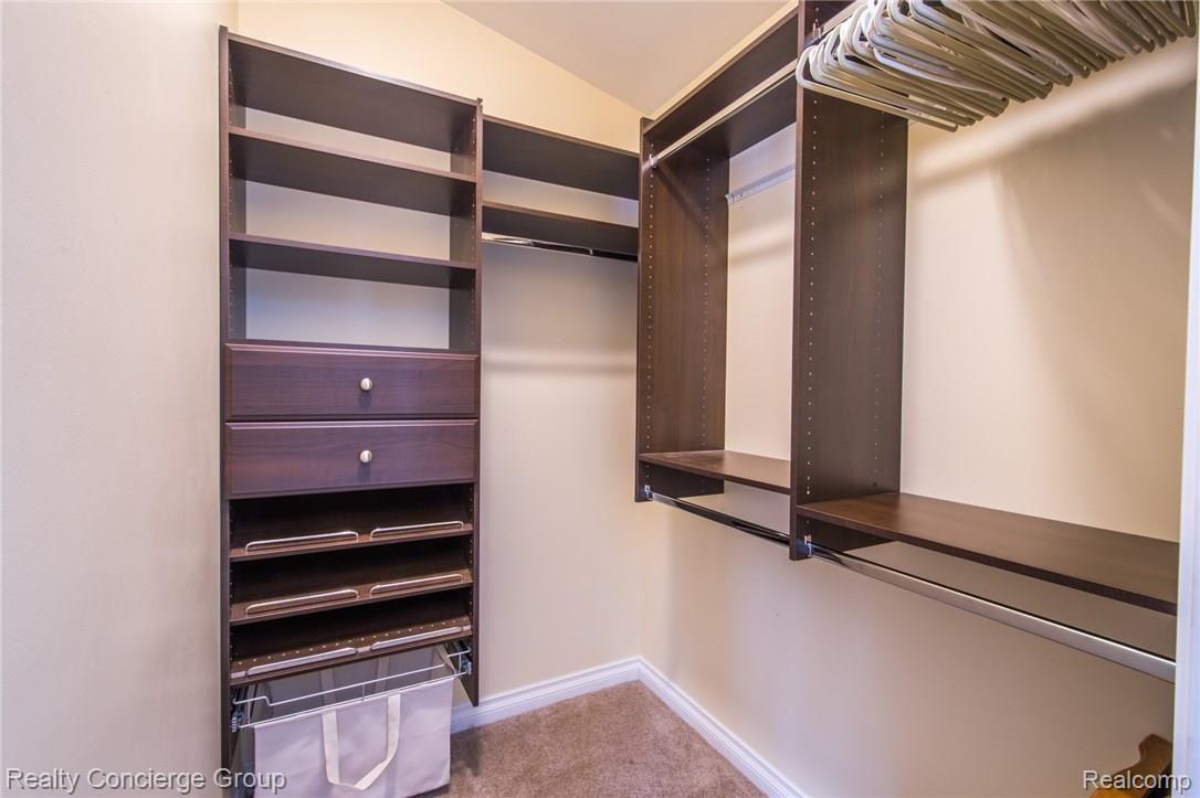 3345 South Latson Road Howell, MI 48843 - Photo 12 of 38 HUGE Walk In Closet with custom organizers in 1st Floor Master or In Law Suite