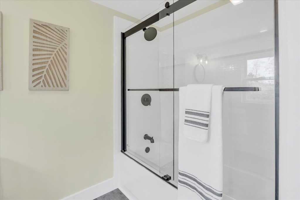 6 Everett Avenue Wareham, MA 02571 - Photo 15 of 33 a bathroom with a shower and a glass door