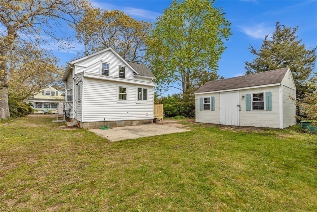 6 Everett Avenue Wareham, MA 02571 - Photo 18 of 33 a view of a yard with a house and a large tree