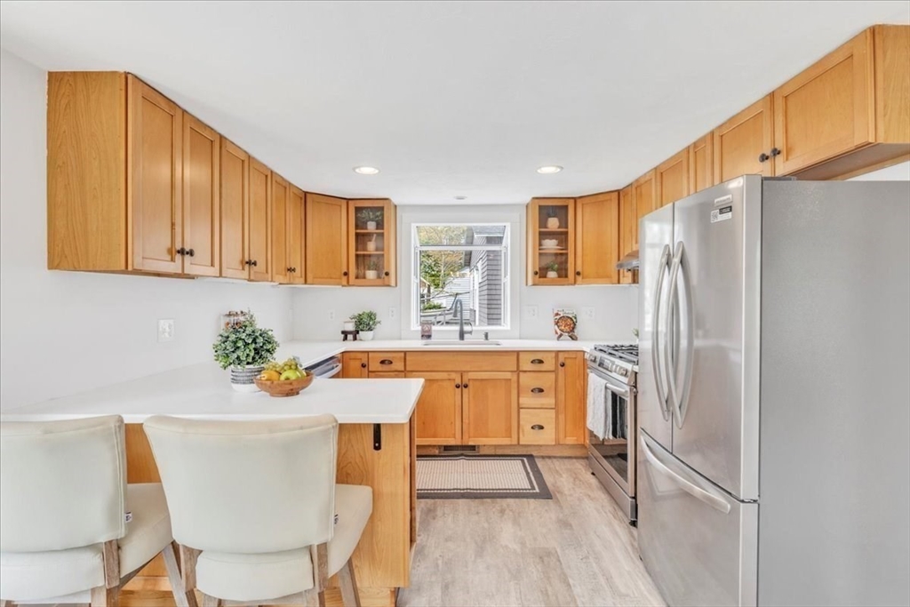 6 Everett Avenue Wareham, MA 02571 - Photo 21 of 33 a kitchen with stainless steel appliances a refrigerator sink and cabinets