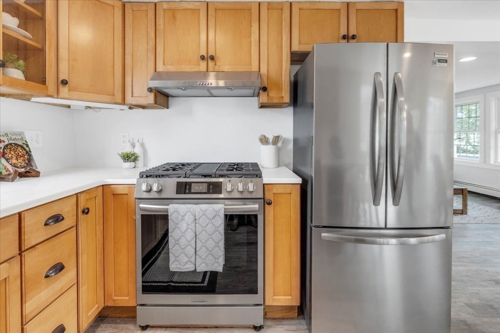 6 Everett Avenue Wareham, MA 02571 - Photo 22 of 33 a kitchen with stainless steel appliances granite countertop a refrigerator and a stove