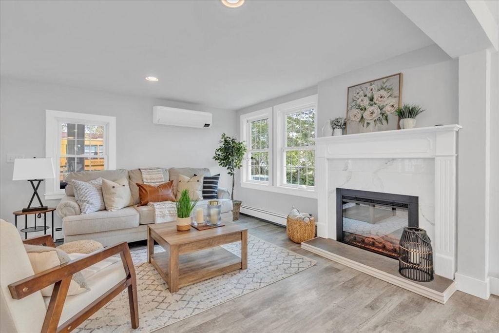 6 Everett Avenue Wareham, MA 02571 - Photo 27 of 33 a living room with furniture and a fireplace