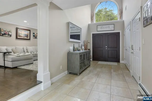 a kitchen with stainless steel appliances granite countertop a refrigerator and a stove