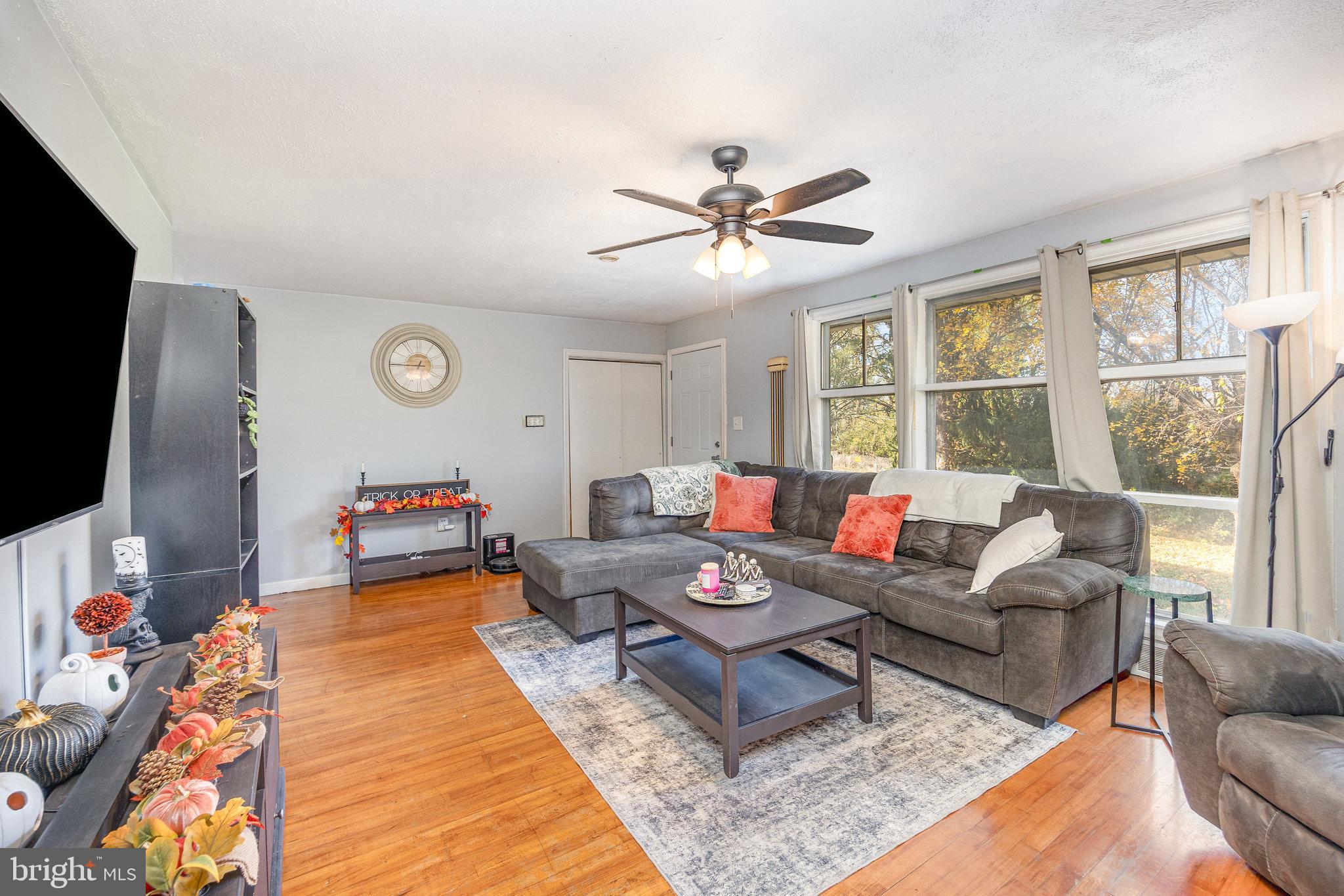 315 James Road Carlisle, PA 17013 - Photo 2 of 47 a living room with furniture and a flat screen tv