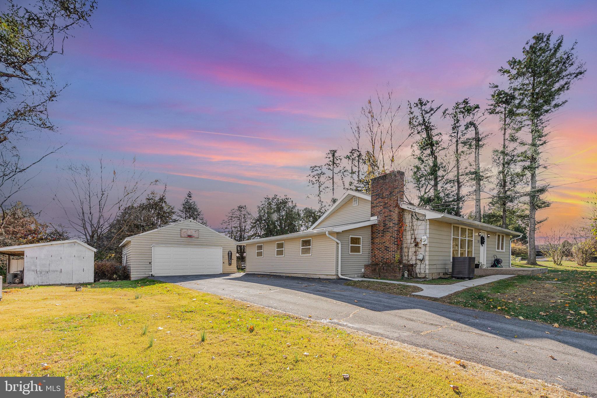 315 James Road Carlisle, PA 17013 - Photo 33 of 47 a front view of a house with a yard and trees