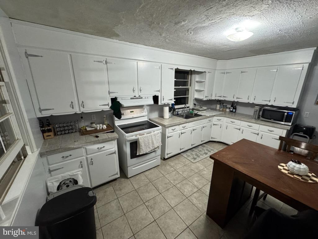 315 James Road Carlisle, PA 17013 - Photo 43 of 47 a kitchen with a sink stove and cabinets