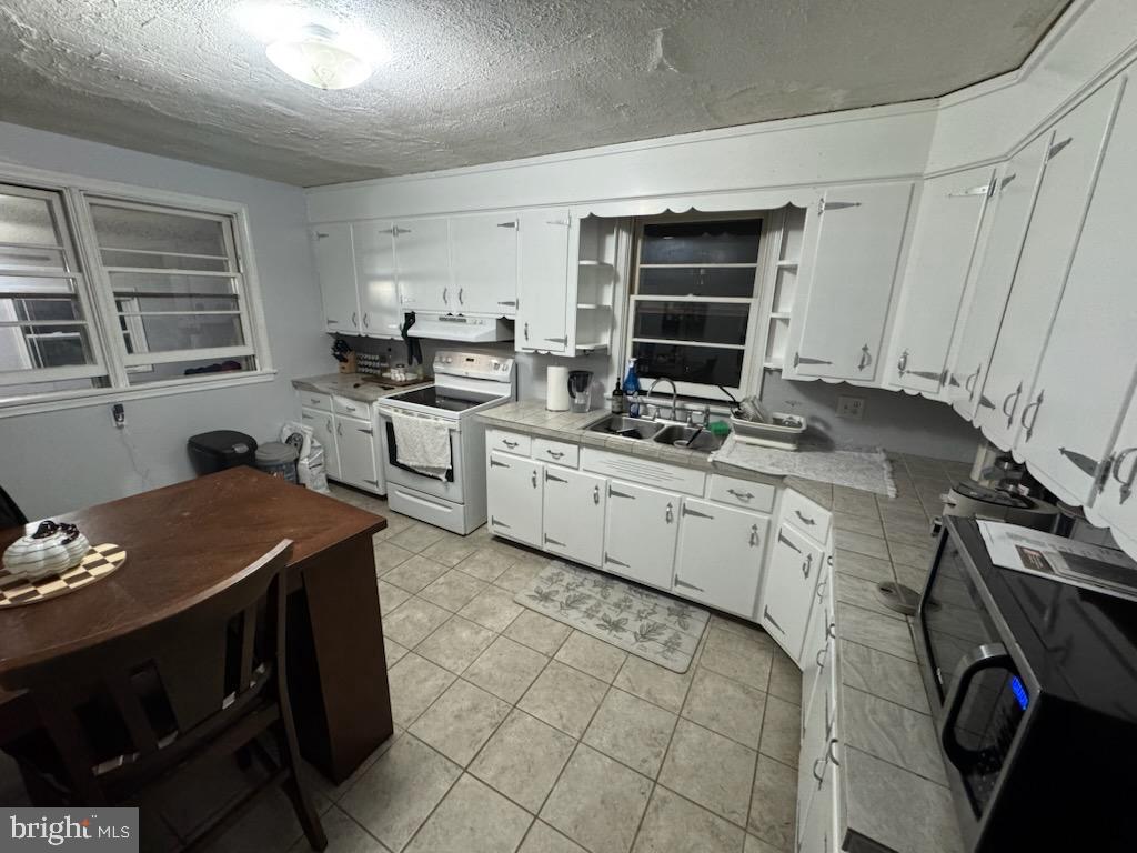 315 James Road Carlisle, PA 17013 - Photo 45 of 47 a kitchen with a stove sink and cabinets