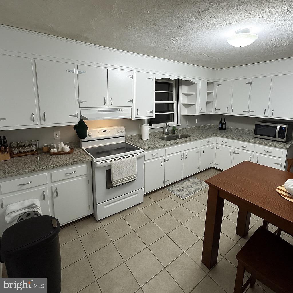 315 James Road Carlisle, PA 17013 - Photo 47 of 47 a kitchen with a stove sink and cabinets