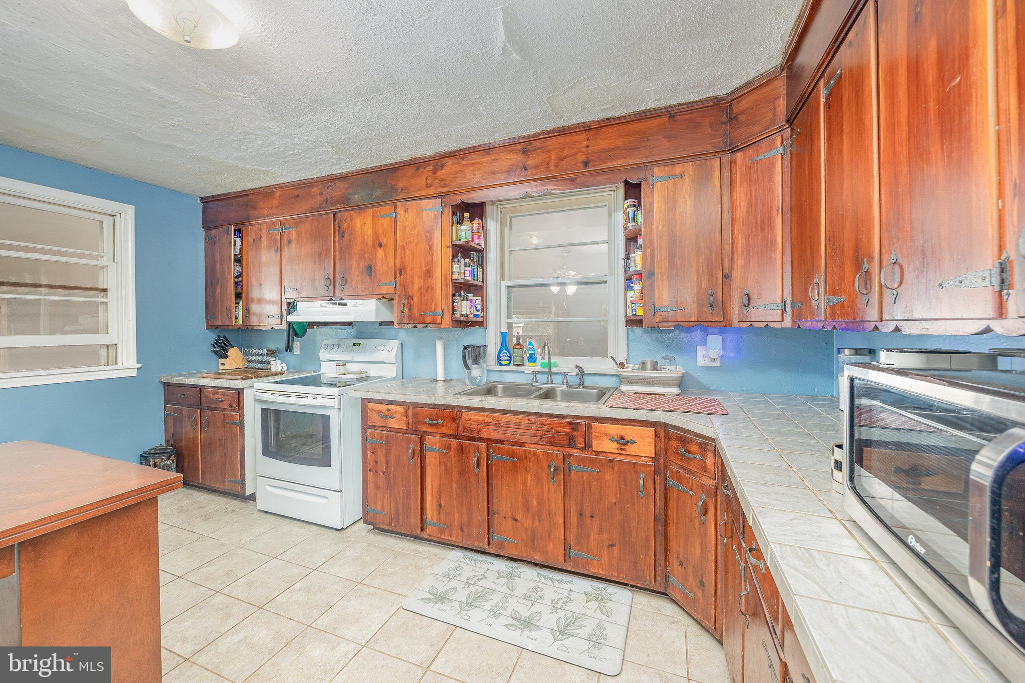 315 James Road Carlisle, PA 17013 - Photo 9 of 47 a kitchen with stainless steel appliances granite countertop a sink and cabinets