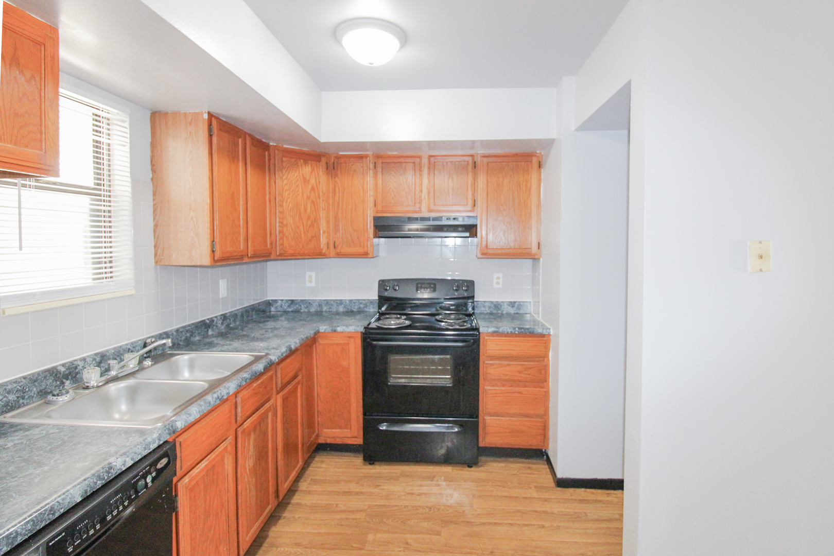 2008 Vawter Street, Unit 103 Urbana, IL 61801 - Photo 9 of 16 a kitchen with stainless steel appliances granite countertop a stove and a sink