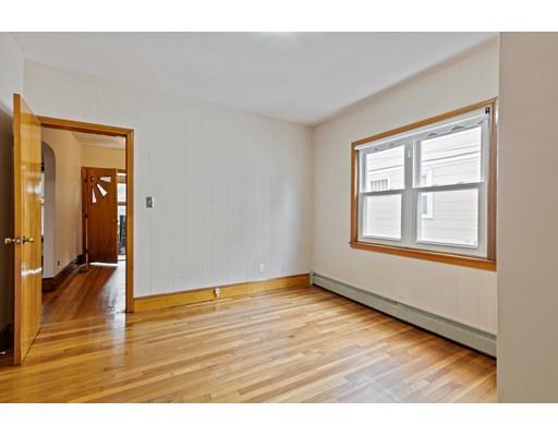 41 Bailey Road Somerville, MA 02145 - Photo 12 of 32 a view of an empty room with wooden floor and a window