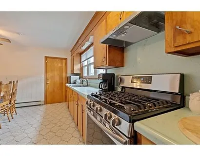 a kitchen with a stove and a refrigerator