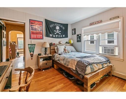 41 Bailey Road Somerville, MA 02145 - Photo 25 of 32 a bedroom with a bed and wooden floor