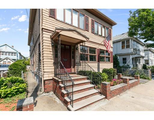 41 Bailey Road Somerville, MA 02145 - Photo 32 of 32 a view of a white house with large windows and flower plants