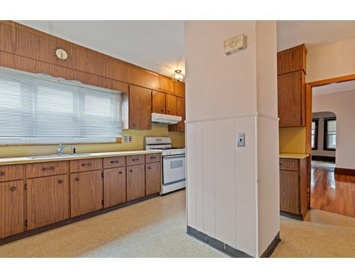 41 Bailey Road Somerville, MA 02145 - Photo 9 of 32 a open kitchen with cabinets and stainless steel appliances