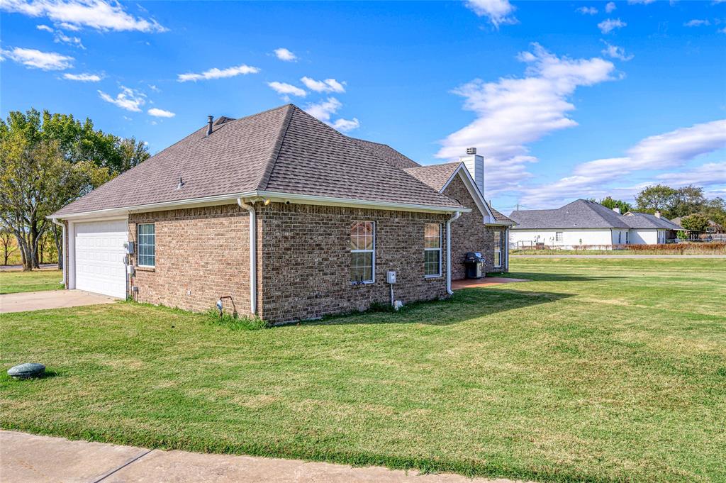 10264 Farmington Road Van Alstyne, TX 75495 - Photo 28 of 39 a view of a house with a yard
