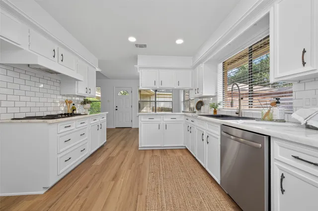 a large kitchen with cabinets
