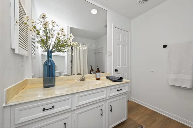a bathroom with a sink a vanity and mirror