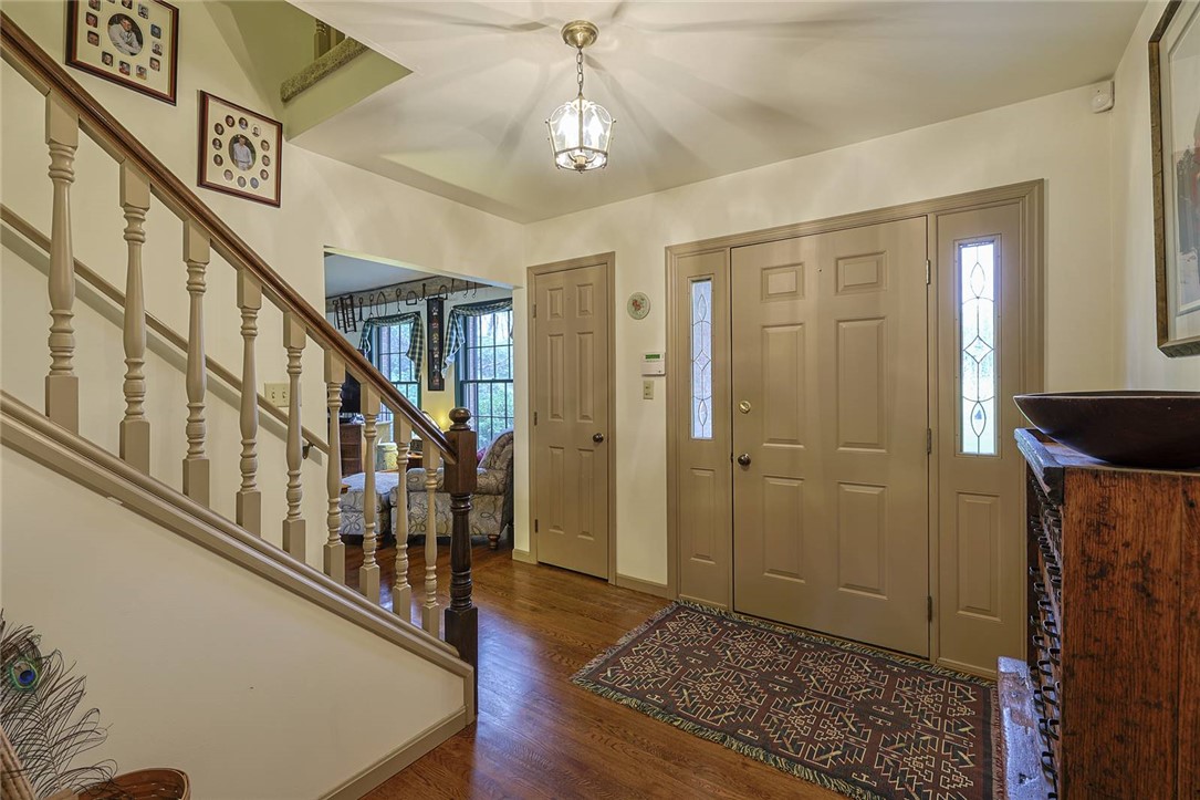 1757 Phillips Road Lebanon, OH 45036 - Photo 6 of 51 This inviting entryway features hardwood floors and a striking staircase, offering a warm welcome.
