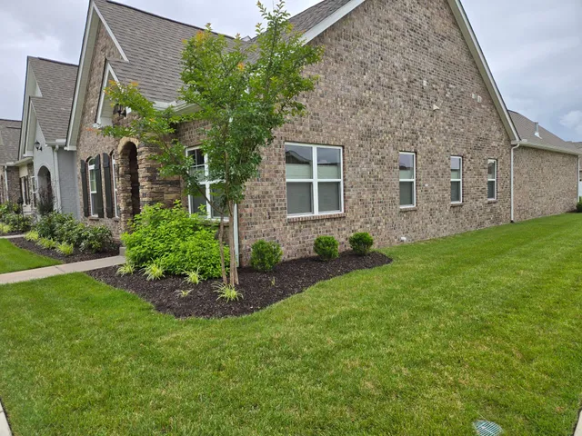 front view of a house with a garden