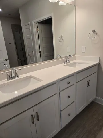 a bathroom with a sink and mirror