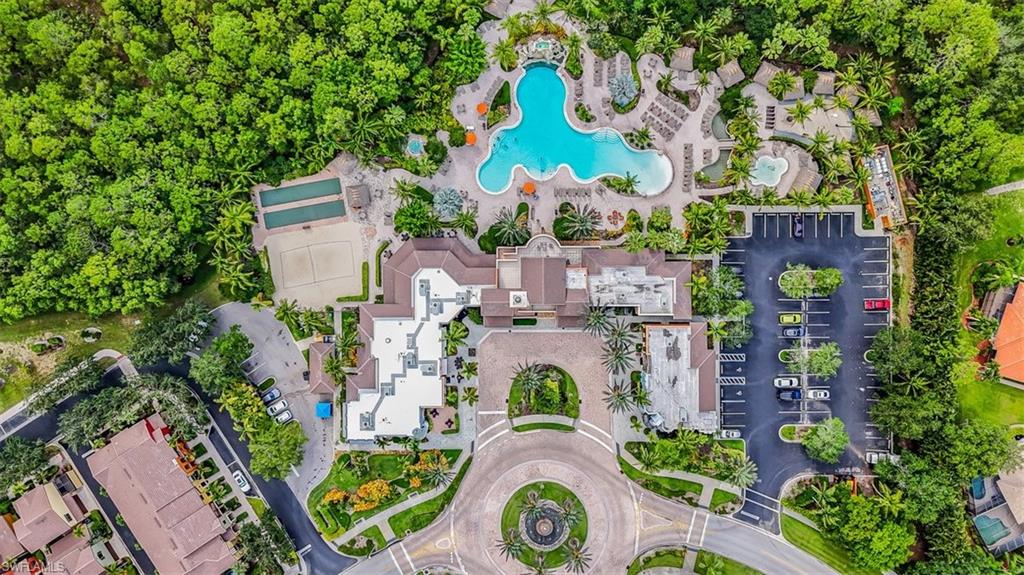 9147 Delano Street, Unit 9605 Naples, FL 34113 - Photo 12 of 27 aerial view of a house with a yard and large trees
