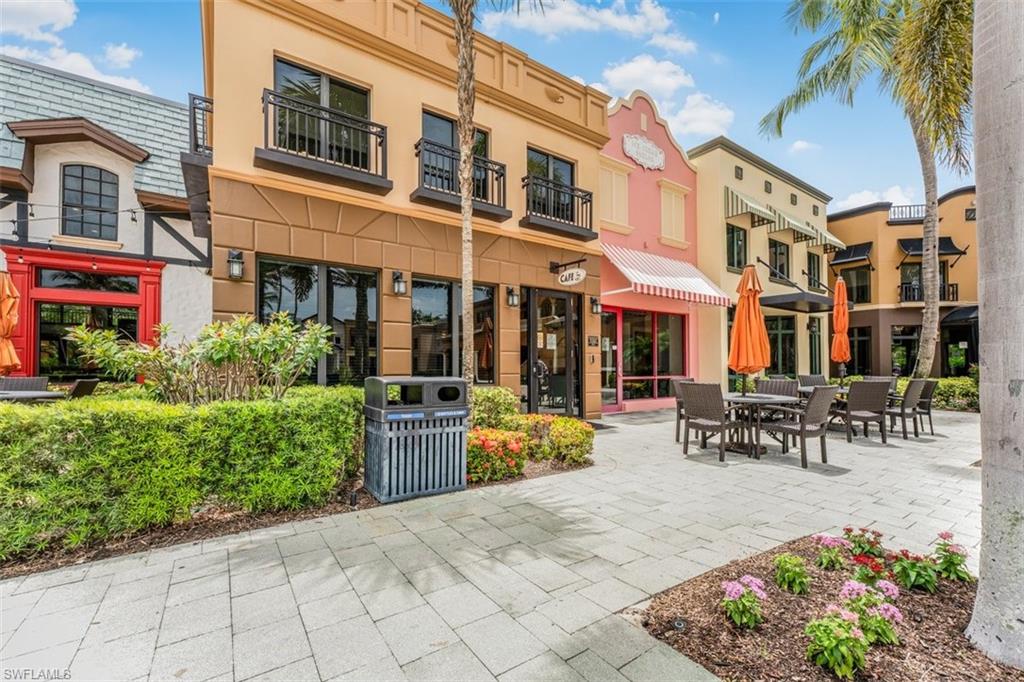 9147 Delano Street, Unit 9605 Naples, FL 34113 - Photo 19 of 27 a view of a building with sitting area