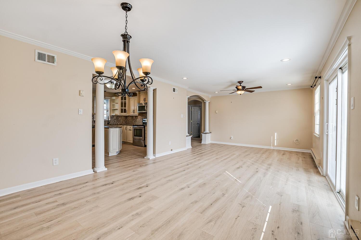 85 Jamestown Road, Unit B Freehold, NJ 07728 - Photo 11 of 36 a view of a room with wooden floor closet and windows