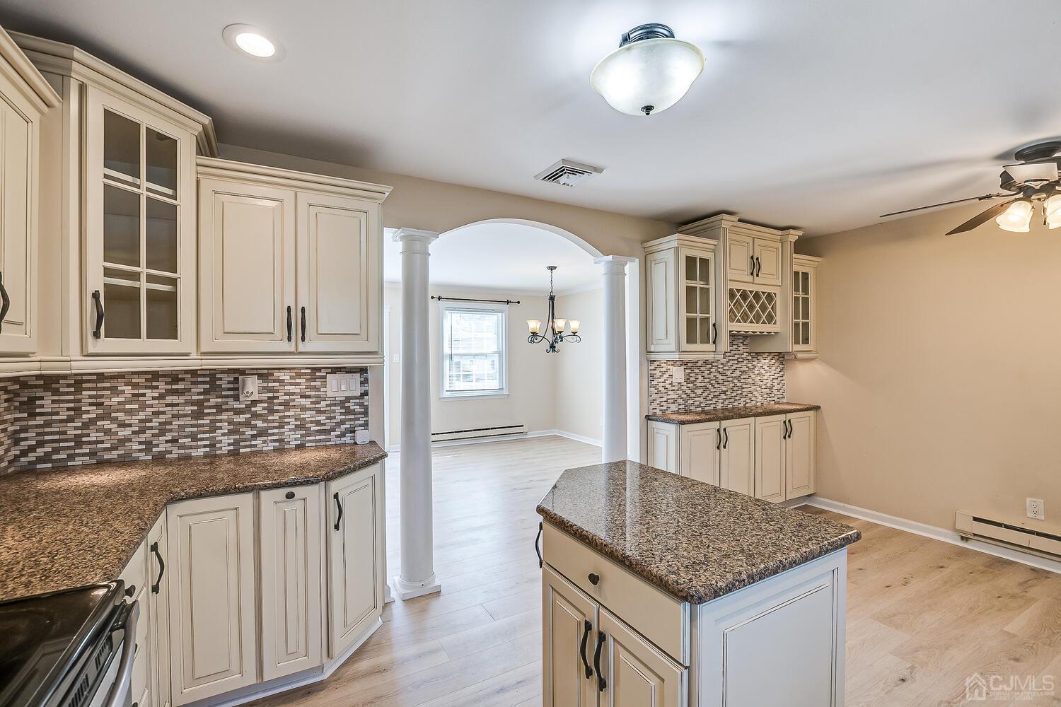 85 Jamestown Road, Unit B Freehold, NJ 07728 - Photo 20 of 36 a kitchen that has a cabinets and a stove