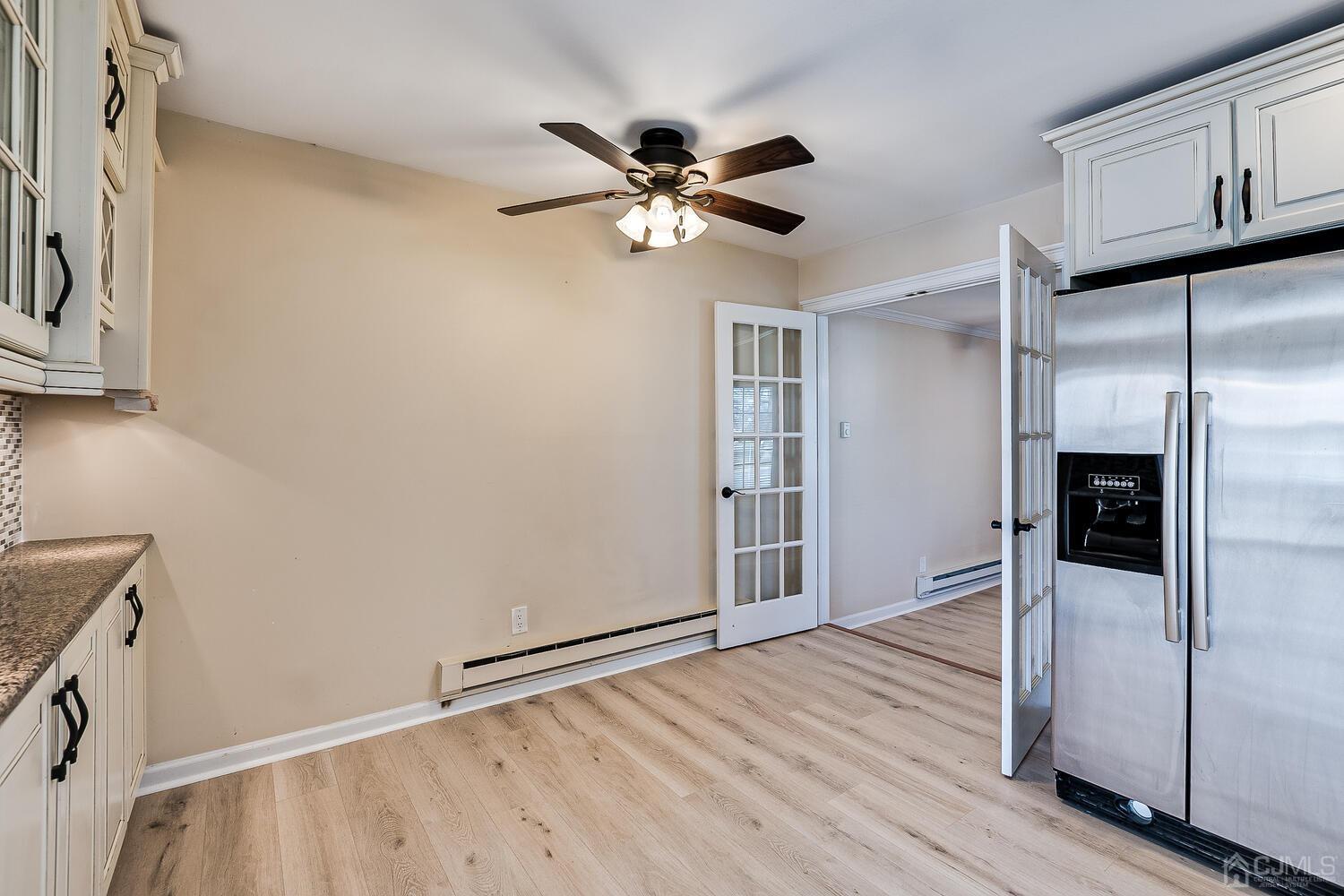 85 Jamestown Road, Unit B Freehold, NJ 07728 - Photo 22 of 36 a view of empty room with wooden floor