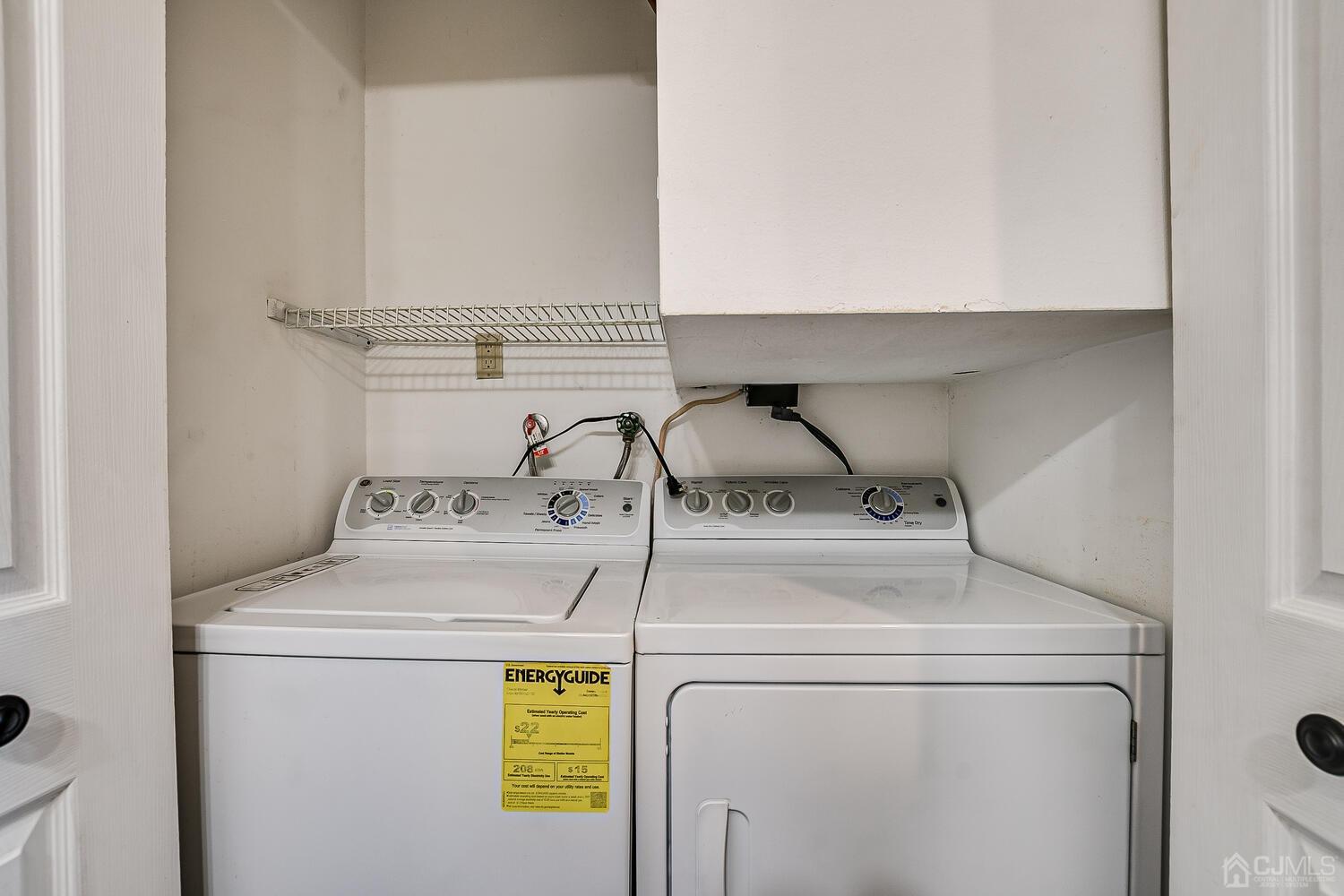 85 Jamestown Road, Unit B Freehold, NJ 07728 - Photo 31 of 36 a utility room with dryer and washer