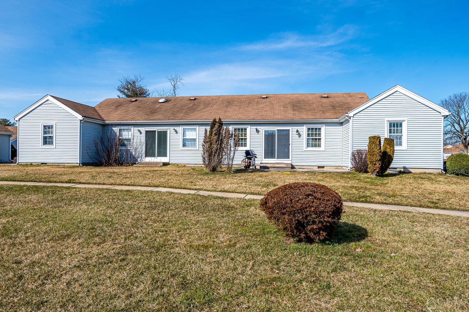 85 Jamestown Road, Unit B Freehold, NJ 07728 - Photo 32 of 36 a house view with a outdoor space