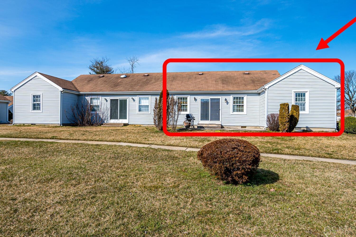 85 Jamestown Road, Unit B Freehold, NJ 07728 - Photo 34 of 36 a house view with a sitting space and garden