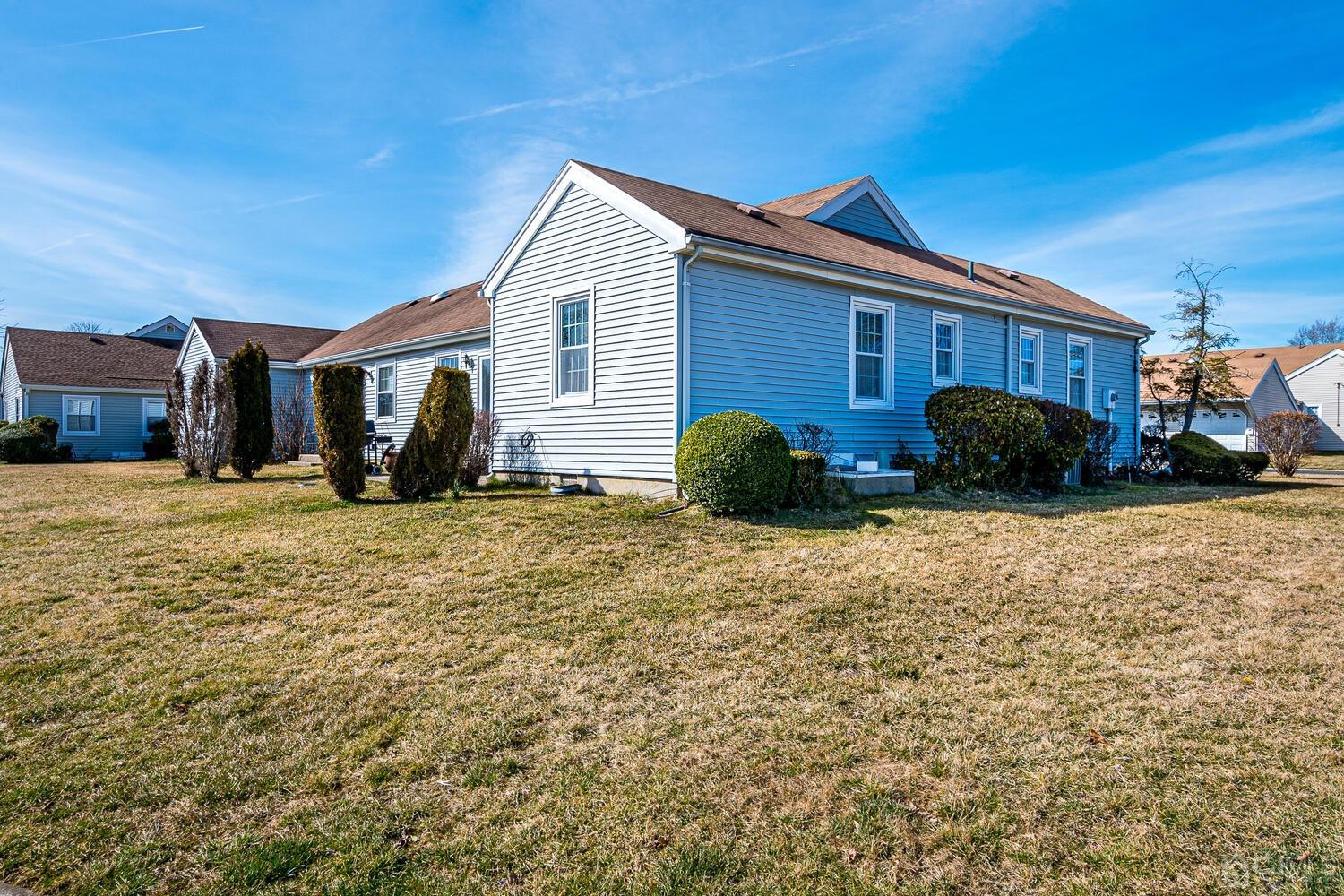 85 Jamestown Road, Unit B Freehold, NJ 07728 - Photo 36 of 36 a view of a house with a yard