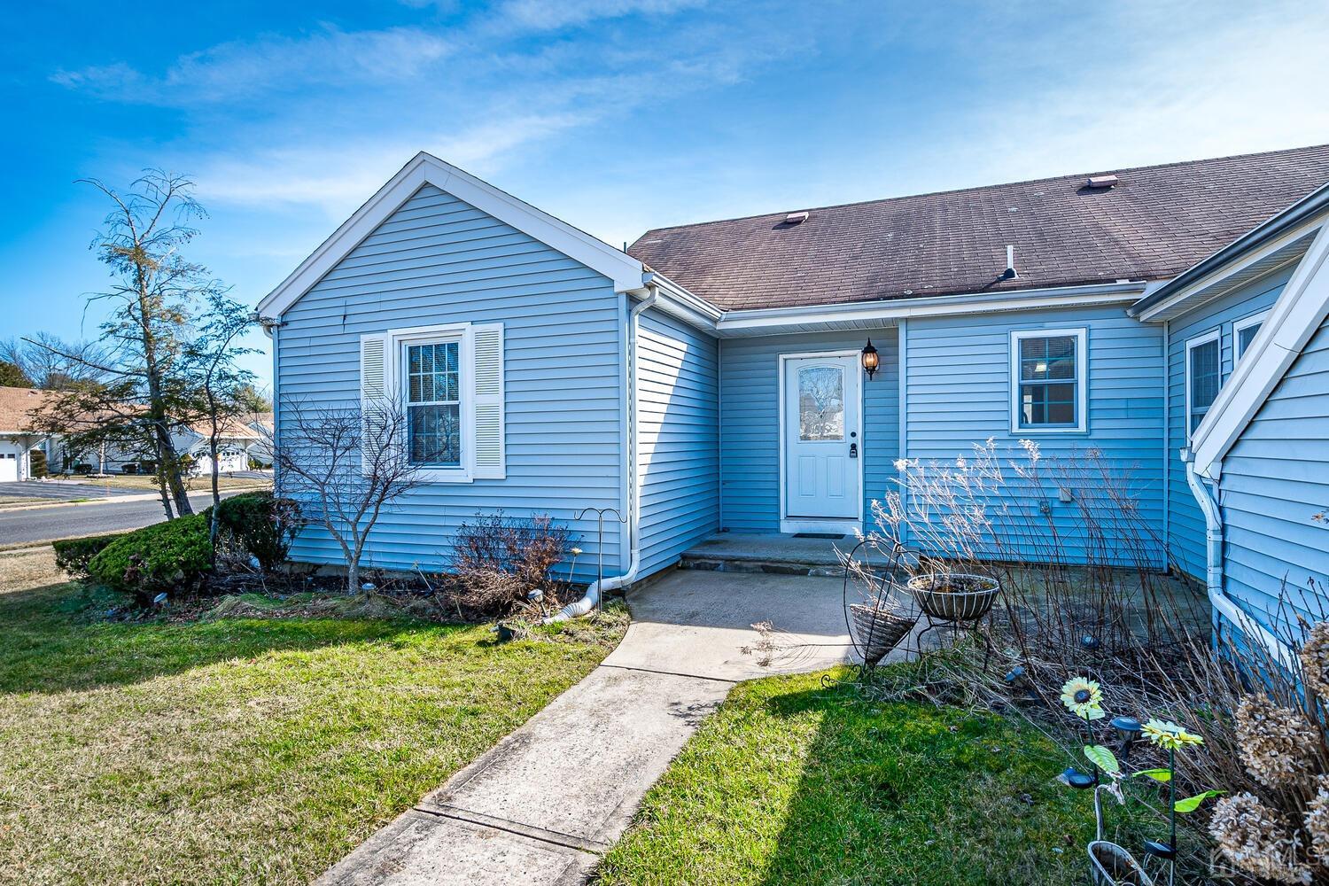 85 Jamestown Road, Unit B Freehold, NJ 07728 - Photo 6 of 36 a view of a small house with a yard