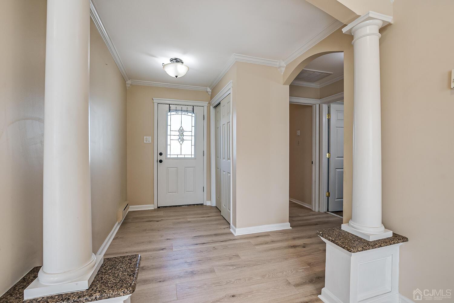 85 Jamestown Road, Unit B Freehold, NJ 07728 - Photo 8 of 36 a view of entryway with wooden floor