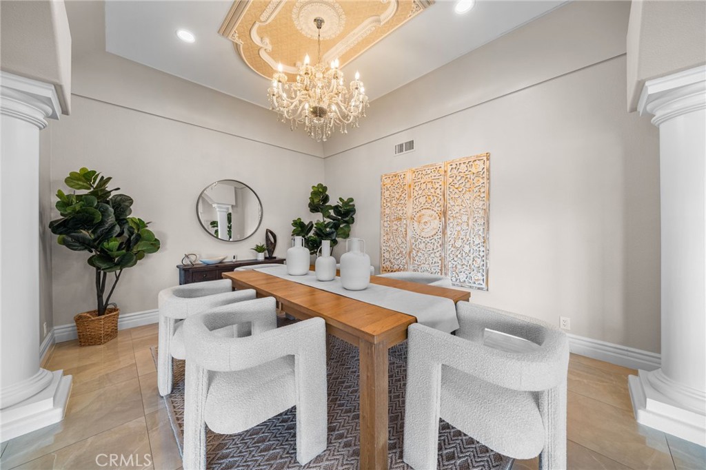 2487 Cliff Road Upland, CA 91784 - Photo 11 of 49 a view of a dining room with furniture and chandelier