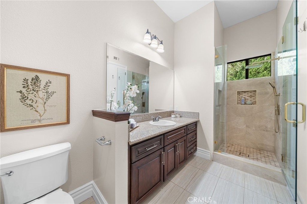 2487 Cliff Road Upland, CA 91784 - Photo 14 of 49 a bathroom with a sink a toilet and shower