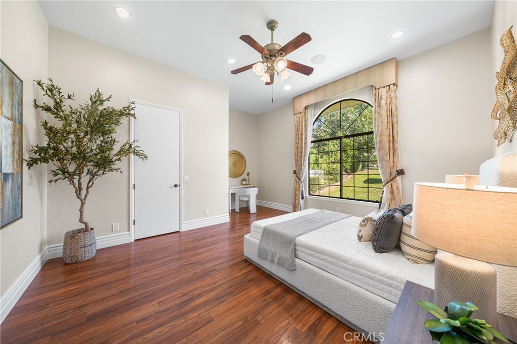 2487 Cliff Road Upland, CA 91784 - Photo 17 of 49 a bedroom with a bed and a large window