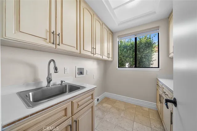 a kitchen with stainless steel appliances granite countertop a sink and a window
