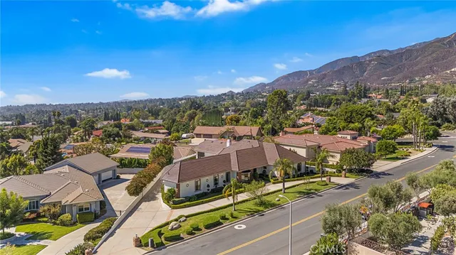 a view of a city with mountains in the background